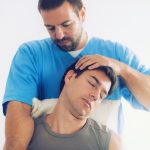 Physiotherapist Working With Patient Neck